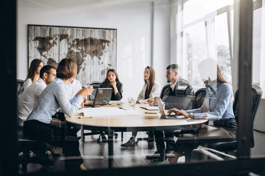 Group Of People Working Out Business Plan In An Office - PAVON | Contabilidade em São Paulo