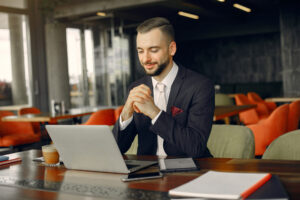 Stylish Businessman Working In A Cafe - PAVON | Contabilidade em São Paulo