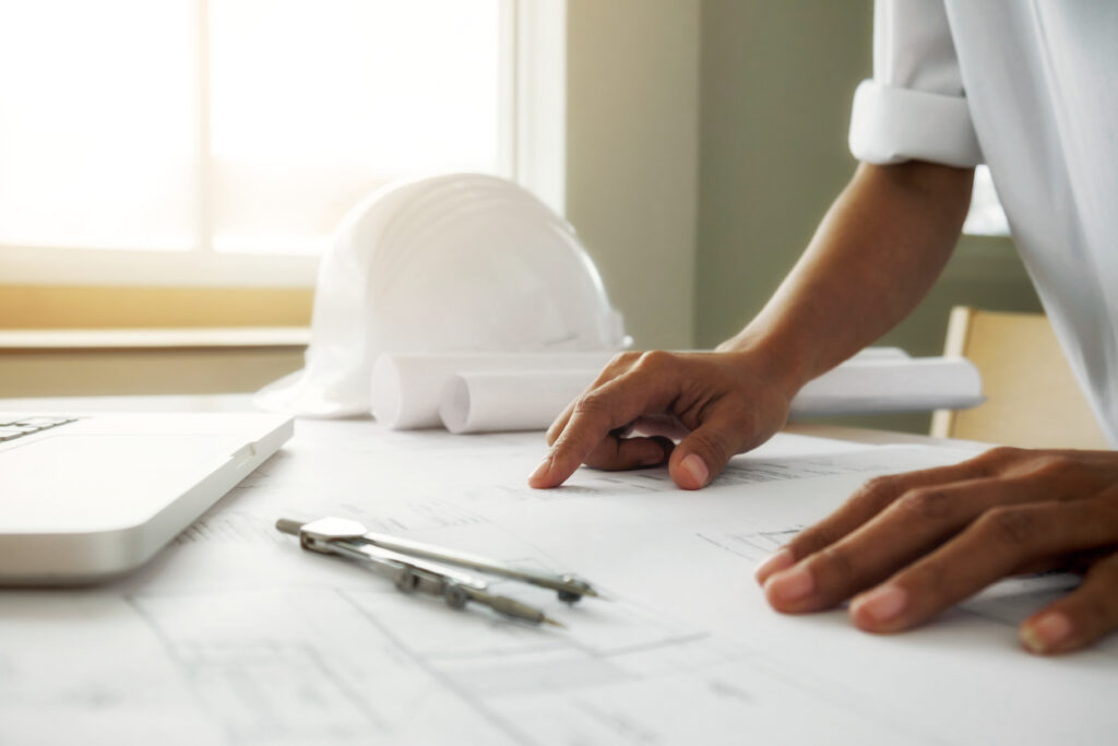 Hands Of Engineer Working On Blueprint,construction Concept. Eng - PAVON | Contabilidade em São Paulo