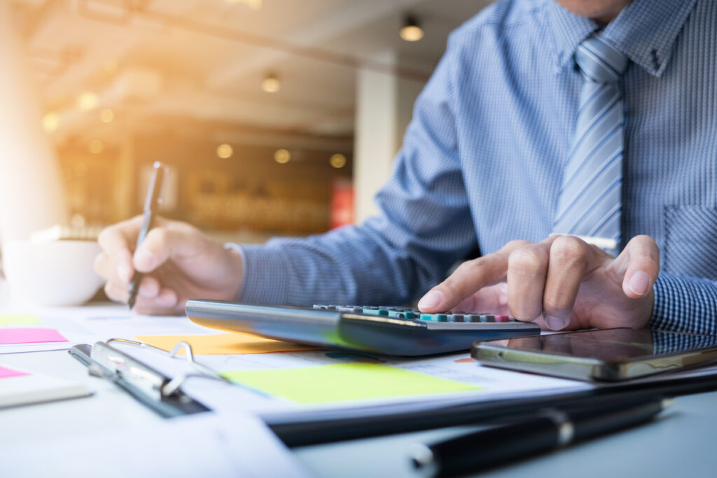 Business Finance Man Calculating Budget Numbers, Invoices And Fi - PAVON | Contabilidade em São Paulo