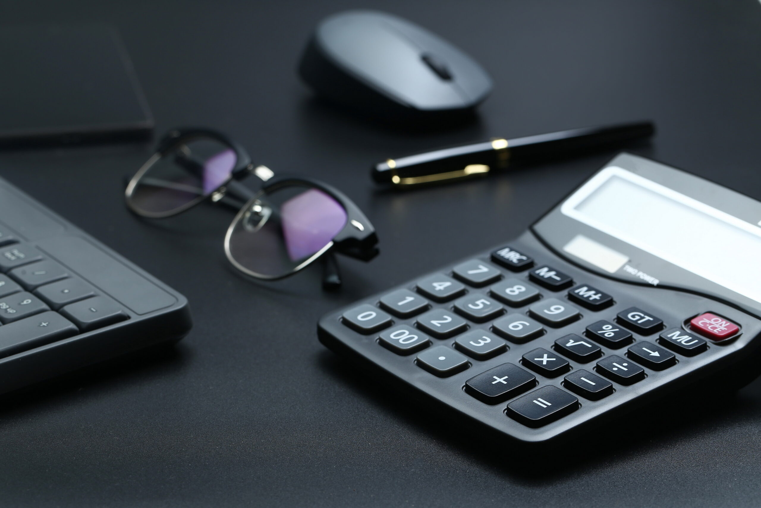 Black Office Business Equipment On Black Background - PAVON | Contabilidade em São Paulo