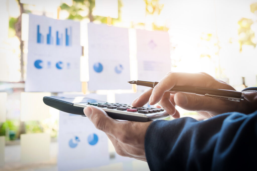 Business Finance Man Calculating Budget Numbers, Invoices And Fi - PAVON | Contabilidade em São Paulo