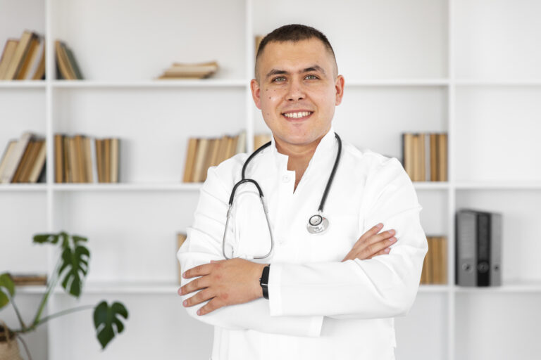 Portrait Smiling Doctor With Cross Hands - PAVON | Contabilidade em São Paulo