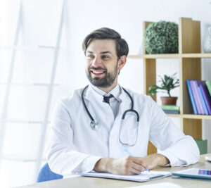 Cheerful Doctor Making Notes Looking Away - PAVON | Contabilidade em São Paulo