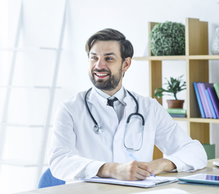 Cheerful Doctor Making Notes Looking Away - PAVON | Contabilidade em São Paulo